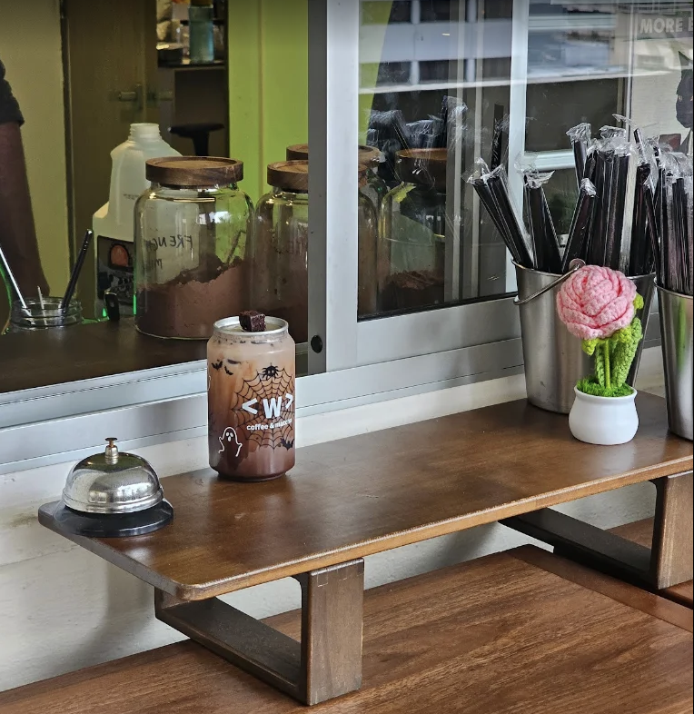 Waterloo Coffee counter with a canned drink and café details