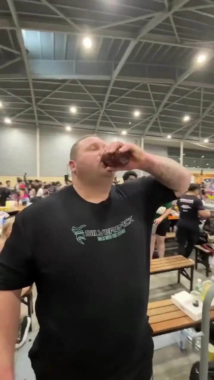 Guests at an indoor event raising Waterloo drinks